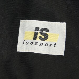 May include: A white label with black text that reads "is" in a large font and "isport" in a smaller font. The "is" is on a yellow background.
