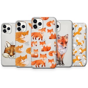 Pode incluir: Quatro capas transparentes para telemóvel com diferentes designs de raposas. As capas apresentam raposas laranja com detalhes brancos sobre um fundo branco. Uma capa tem uma única raposa grande no centro.