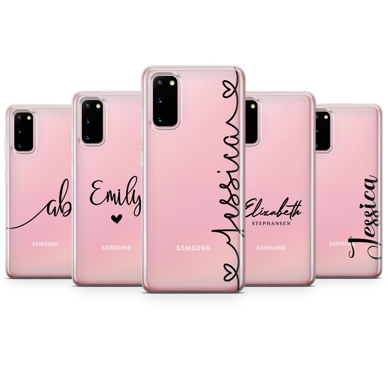 May include: Five clear phone cases with pink backgrounds and black cursive writing. The names on the cases are "ab", "Emily", "Jessica", "Elizabeth Stephansen", and "Jessica".