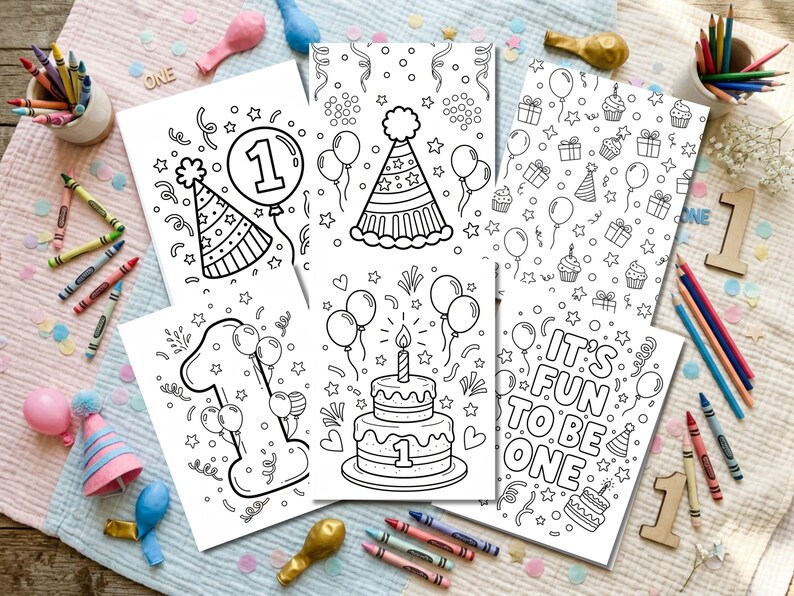 May include: Several black and white coloring pages with birthday designs, such as balloons, party hats, and cakes. One page features the text "IT'S FUN TO BE ONE". Colouring pencils and crayons are arranged around the pages.