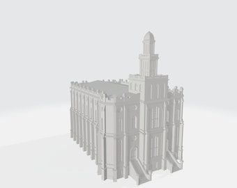 May include: A white, detailed model of a church with a tall spire and multiple windows.