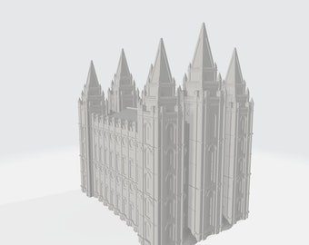 May include: A white, detailed model of a large, ornate building with multiple towers and spires. The building has many windows and intricate details.