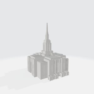 May include: A white model of a temple with a tall spire and intricate details. The model is set against a white background.