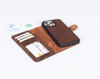 May include: A brown leather phone case and wallet combination. The case is open, displaying card slots and a clear ID window. A smartphone is inside the case. The case features a magnetic closure.