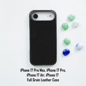May include: A black full-grain leather case for iPhone 17 Pro Max, iPhone 17 Pro, iPhone 17 Air, and iPhone 17. The case is shown with colorful decorative stones.