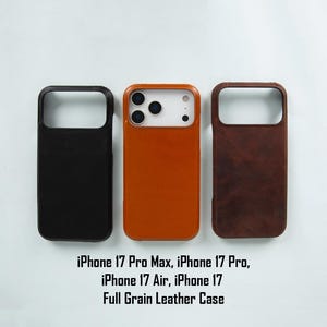 May include: Three leather phone cases in black, orange, and brown. The cases are designed for various iPhone 17 models, including the Pro Max, Pro, Air, and standard versions. The text at the bottom reads "iPhone 17 Pro Max, iPhone 17 Pro, iPhone 17 Air, iPhone 17 Full Grain Leather Case."