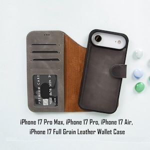 May include: A gray leather iPhone 17 wallet case with card slots and a brown interior. The case is open, displaying a phone and a credit card. The text on the image reads: iPhone 17 Pro Max, iPhone 17 Pro, iPhone 17 Air, iPhone 17 Full Grain Leather Wallet Case.