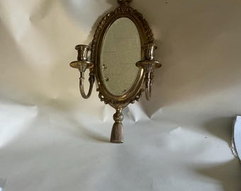 Metal framed mirror gold with candle holders