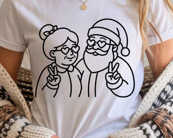 Pareja de Papá Noel y la Sra. Claus PNG / Diseño de camiseta navideña / Camiseta navideña de amor y paz / PNG imprimible