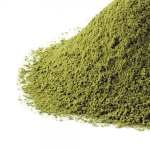 May include: A close-up of a pile of green matcha powder. The powder is finely ground and has a light, airy texture.