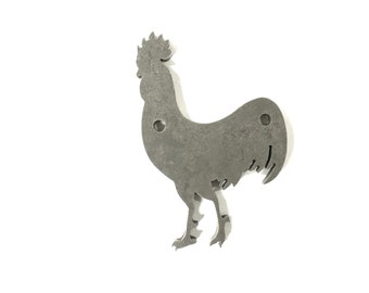 May include: A metal rooster silhouette with a distressed finish. The rooster has two holes in the body for hanging.
