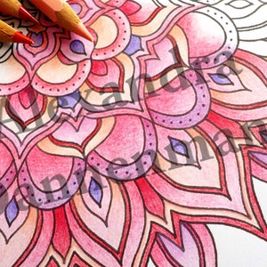 May include: A detailed mandala design with intricate patterns and shapes. The mandala is colored in shades of pink, red, and purple. The design is symmetrical and has a circular shape.