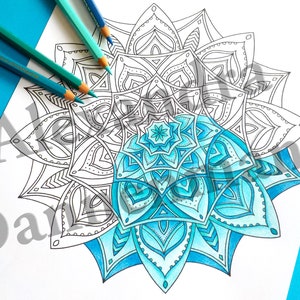 May include: A detailed mandala design with a blue and white color gradient. The mandala is partially colored in shades of blue, while the other half is left uncolored.