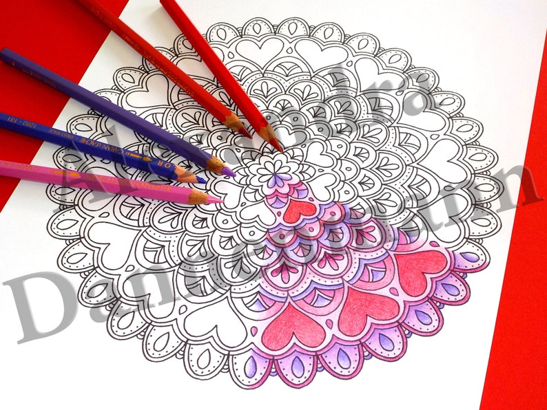 May include: A black and white mandala coloring page with a heart design. The mandala is partially colored in shades of pink and purple.