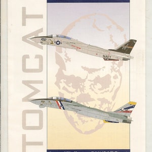 May include: A sheet of decals for model aircraft, featuring two F-14 Tomcat fighter jets in a white, grey, and blue colour scheme. The decals are from Eagle Strike Productions and are labelled "F-14 Tomcats Part III".