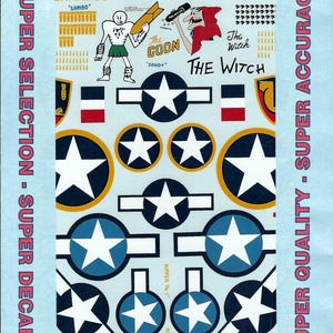 May include: A sheet of waterslide decals for B-24 Liberator model aircraft, featuring various national insignia, star-and-bar emblems, and nose art graphics including characters labeled The Goon, Sandy, and The Witch with text 48-265 B-24 Liberators.