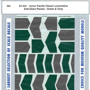 May include: A sheet of model train decals for a Union Pacific Diesel Locomotive. The decals are for anti-glare panels and are in green and grey. The decal sheet is labeled "87-431" and "Microscale Decal, Just for the Realism".