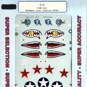 May include: A sheet of Super Scale decals for a P-40E Warhawk aircraft. The decals include red stars, white stars in blue circles, and shark mouth designs. The text on the sheet reads "Super Selection - Super Decals" and "Super Quality - Super Accuracy."