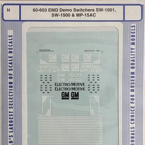 May include: A Microscale Decal sheet for model railroading. The sheet features decals for EMD Demo Switchers SW-1001, SW-1500 & MP-15AC. The decals include the logos "GM", "SW1001", "MP15AC", "SW 1500", "ELECTRO-MOTIVE", and "GM".
