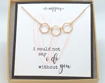 May include: Gold necklace with three hexagon charms in a box with a card that says "i could not say i do without you".