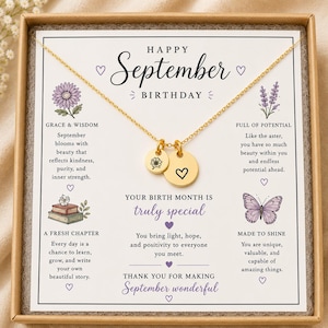 May include: A gold-toned necklace with two circular charms, one featuring an engraved flower and the other a heart, presented on a white card with the text Happy September Birthday, floral illustrations, and inspirational messages about birth months.