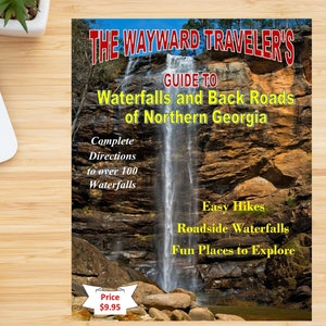 May include: A book cover with a yellow and black title "The Wayward Traveler's Guide to Waterfalls and Back Roads of Northern Georgia". The cover features a photo of a waterfall cascading down a rocky cliff.