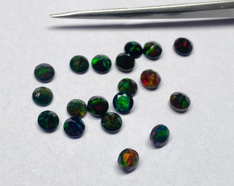 A PAIR OF 3mm ROUND CABOCHON-CUT NATURAL WELO BLACK OPAL GEMSTONES 