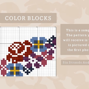 Op de afbeelding: Een kleurblok-cross-stitch patroon met een cluster van gestileerde bloemen in tinten rood, paars, blauw, geel en zwart. Het patroon wordt weergegeven op een raster.