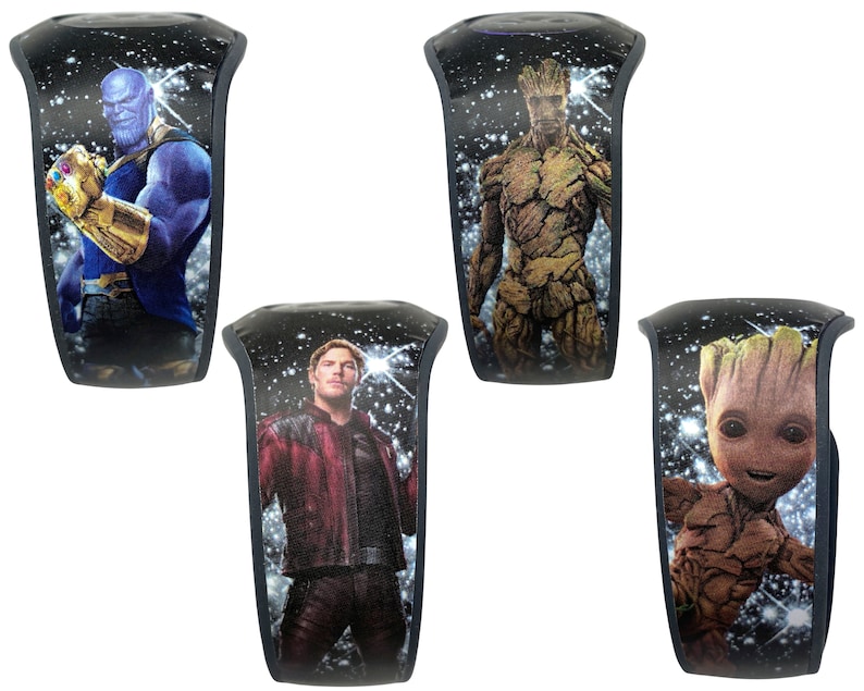 May include: Four different black wristbands with a galaxy background and images of characters from the Marvel Cinematic Universe. The characters are Thanos, Groot, Baby Groot, and Star-Lord.