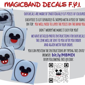 May include: Image of MagicBand decals with Mickey Mouse designs. The decals are made of colored vinyl and come with transfer tape. Instructions are available online at bit.ly/MBMDI or via QR code.