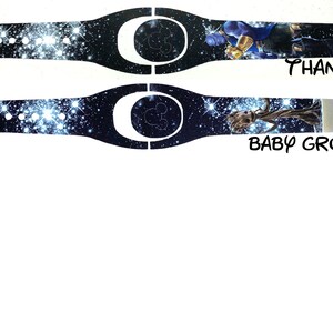 May include: Two Disney MagicBand designs with a galaxy print background. The top band features Thanos from the Avengers movie. The bottom band features Baby Groot from Guardians of the Galaxy. Both bands have the text "THANOS" and "BABY GROOT" printed below the image.