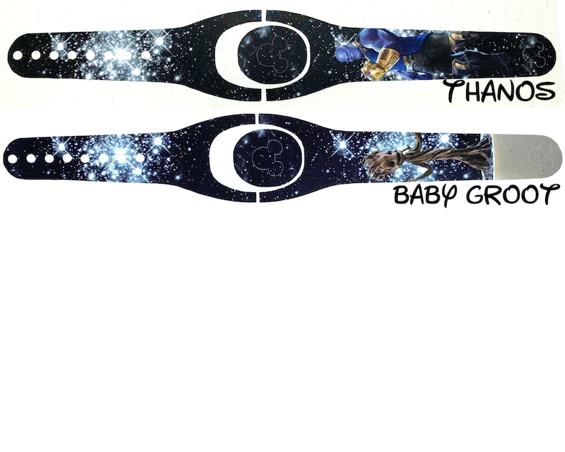 May include: Two Disney MagicBand designs with a galaxy print background. The top band features Thanos from the Avengers movie. The bottom band features Baby Groot from Guardians of the Galaxy. Both bands have the text "THANOS" and "BABY GROOT" printed below the image.