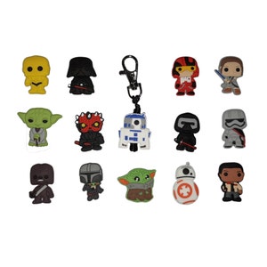 May include: A set of 14 Star Wars character keyrings. The keyrings are made of rubber and feature characters such as Darth Vader, Yoda, R2-D2, and BB-8.