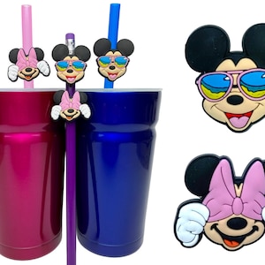 May include: Four colourful silicone straw toppers featuring a cartoon mouse with different expressions. The toppers are shown on straws and pencils. The mouse is wearing sunglasses, a bow, and has a happy expression.