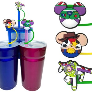 May include: Three stainless steel tumblers with lids, each with a different character from the Toy Story movie franchise attached to a straw. The characters are Woody, Buzz Lightyear, and Jessie. The tumblers are blue, purple, and green.