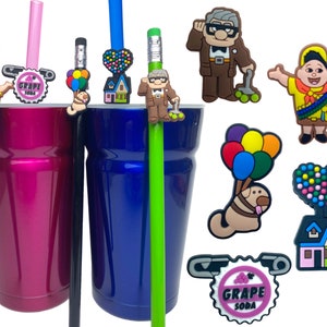 May include: A collection of rubber charms featuring characters and icons from the movie Up, including a boy scout, an elderly man, a house with balloons, a dog with balloons, and a Grape Soda bottle cap pin, attached to pencils and tumblers.