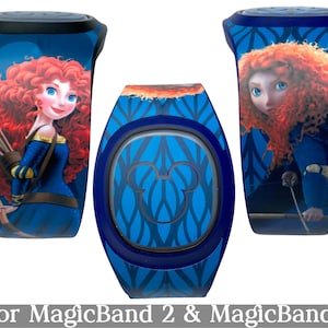 May include: Three blue MagicBand+ devices featuring the character Merida from the Disney movie Brave. The bands have a blue background with a pattern and a portrait of Merida. The text "for MagicBand 2 & MagicBand+" is at the bottom.