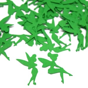 May include: A collection of small, flat, bright green paper cutouts shaped like fairies. Each cutout features a silhouette of a winged figure in various poses, including standing and sitting, scattered across the frame in a loose arrangement.