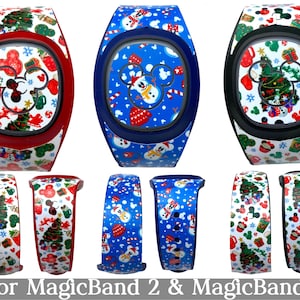 May include: A collection of MagicBand 2 and MagicBand+ accessories with festive Christmas designs. The bands feature Mickey Mouse, snowmen, Christmas trees, and other holiday elements in red, blue, and green. The text "for MagicBand 2 & MagicBand+" is at the bottom.