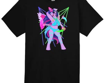 May include: Black t-shirt with a vibrant cartoon pony design. The pony has wings, a horn, and a flowing mane, set against neon green and blue geometric shapes. The shirt is made of a soft material, suitable for casual wear.