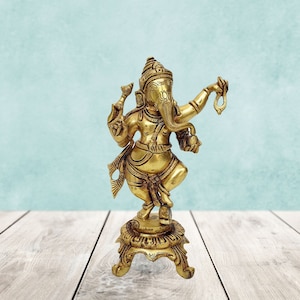 Brass Dancing Ganesha Idol in Antique Golden Finish
