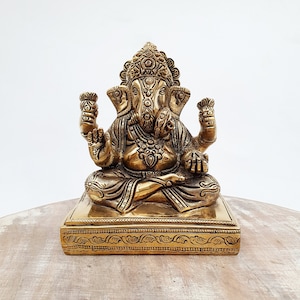Brass Lord ganesha sitting on Chowki