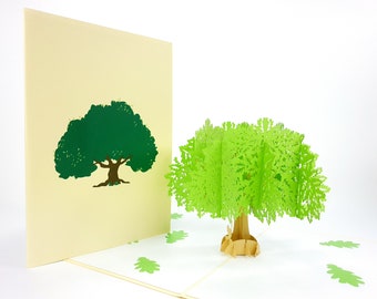 May include: A green pop-up card featuring a 3D tree with a flat, green tree silhouette on the front of the card.