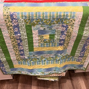 Green and blue lap quilt