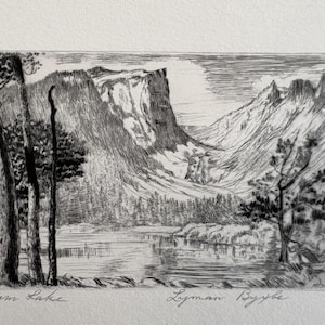 May include: Black and white etching of a mountain landscape with a lake and trees. The artwork, titled "Dream Lake" by Lyman Bybe, depicts a serene natural scene with detailed linework. The image is on a white background.