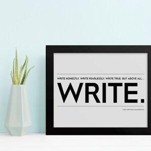May include: Black framed print with a white background and the text "WRITE HONESTLY. WRITE FEARLESSLY. WRITE TRUE. BUT ABOVE ALL... WRITE." and "THE WRITING MANIFESTO" in smaller font below.
