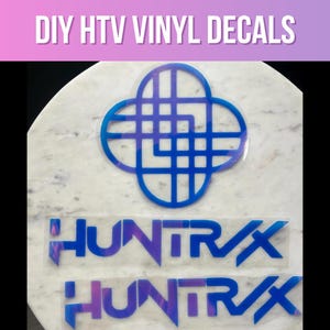 May include: DIY HTV Vinyl Decals. The image shows two "HUNTRX" decals in a blue and purple gradient, along with a blue and white geometric design. The decals are on a white marble surface.