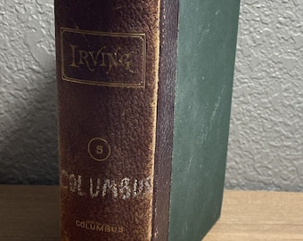 May include: A vintage, brown leather-bound book with gold lettering. The title is "Irving" and the book is labeled "5 Columbus". The book has a green spine.