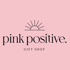 May include: Pink and black logo with a stylized sun graphic and the text "pink positive. GIFT SHOP"