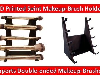 May include: 3D printed makeup brush holder with two different designs. One design is a vertical stand with four slots for brushes. The other design is a triangular stand with six slots for brushes. Both designs are black and support double-ended makeup brushes.